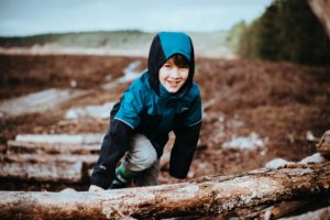 child smiling outdoors